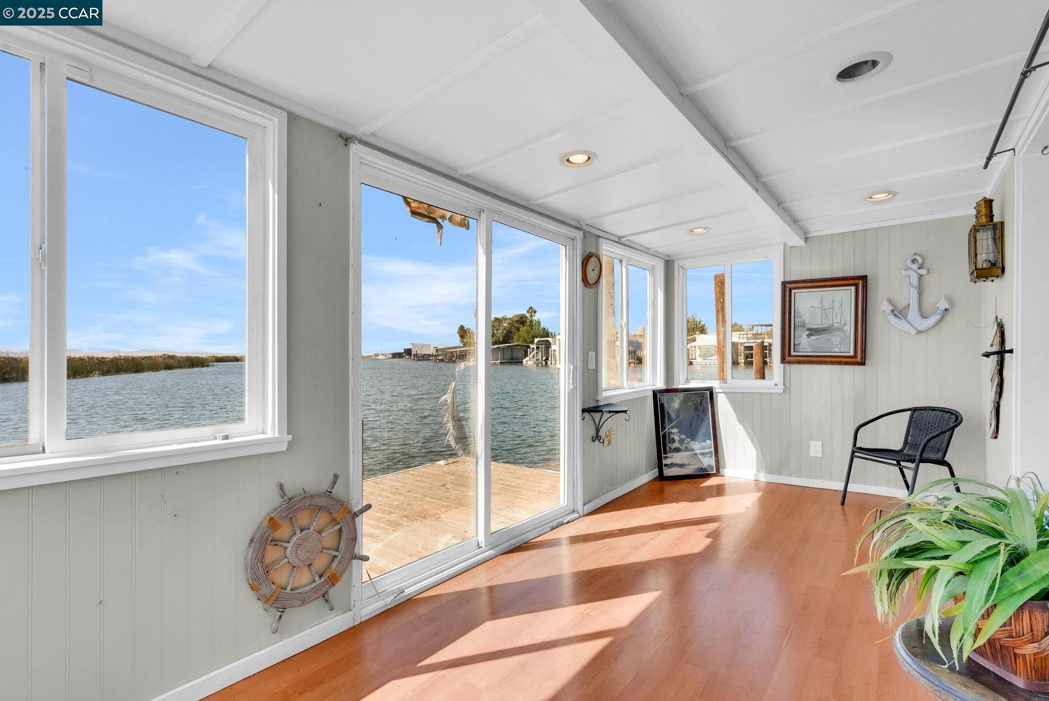 1818 Taylor Road Bethel Island, CA 94511 - Photo 21 of 59 a living room with furniture and a large window