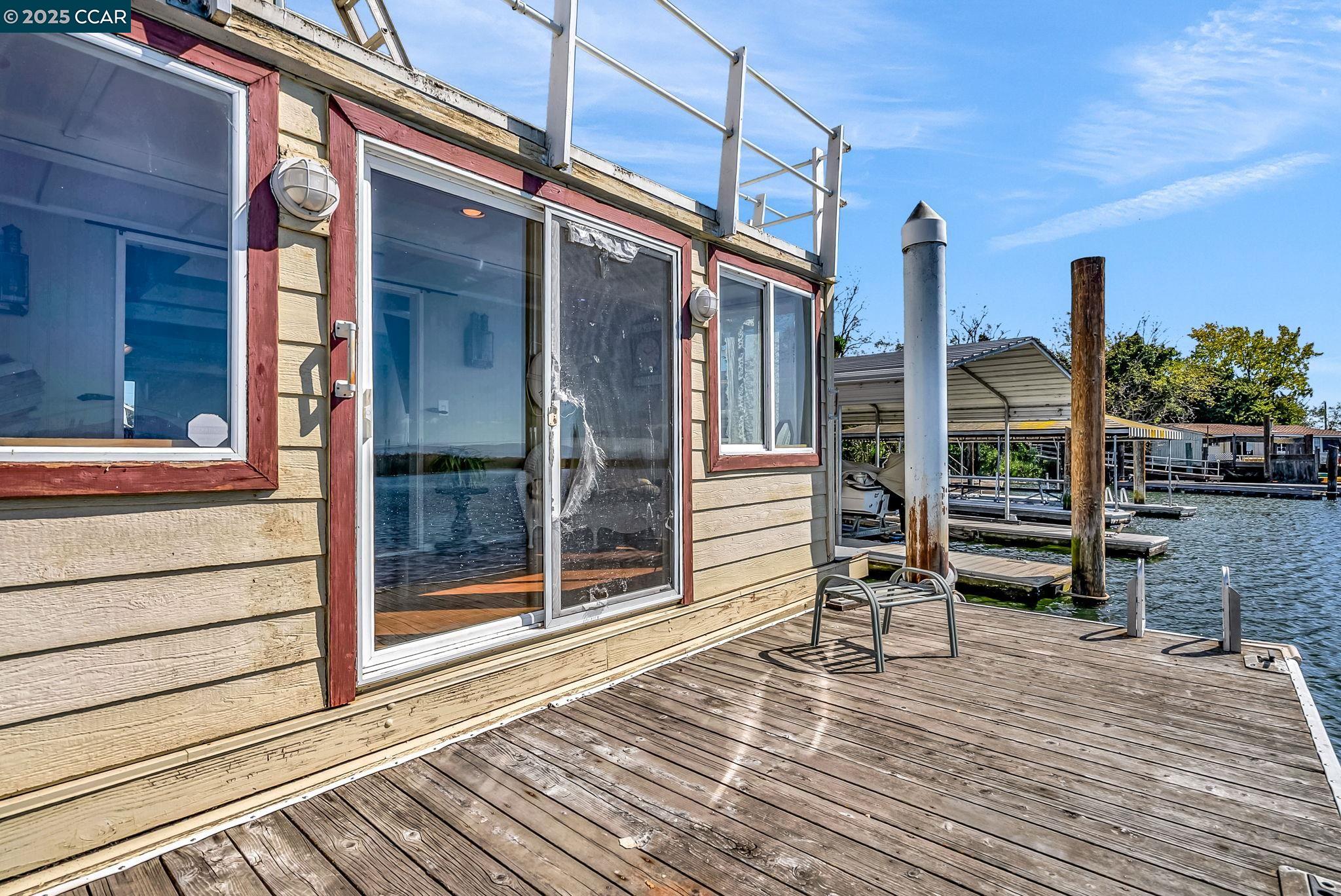1818 Taylor Road Bethel Island, CA 94511 - Photo 22 of 59 a view of a balcony with wooden floor and iron stairs