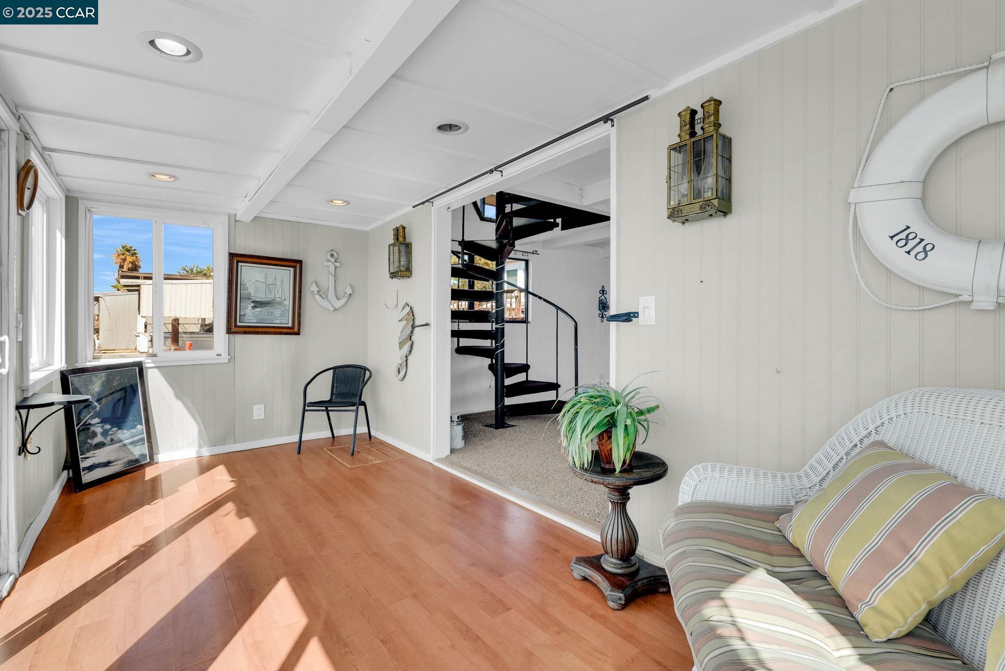 1818 Taylor Road Bethel Island, CA 94511 - Photo 25 of 59 a living room with furniture a wooden floor and a potted plant