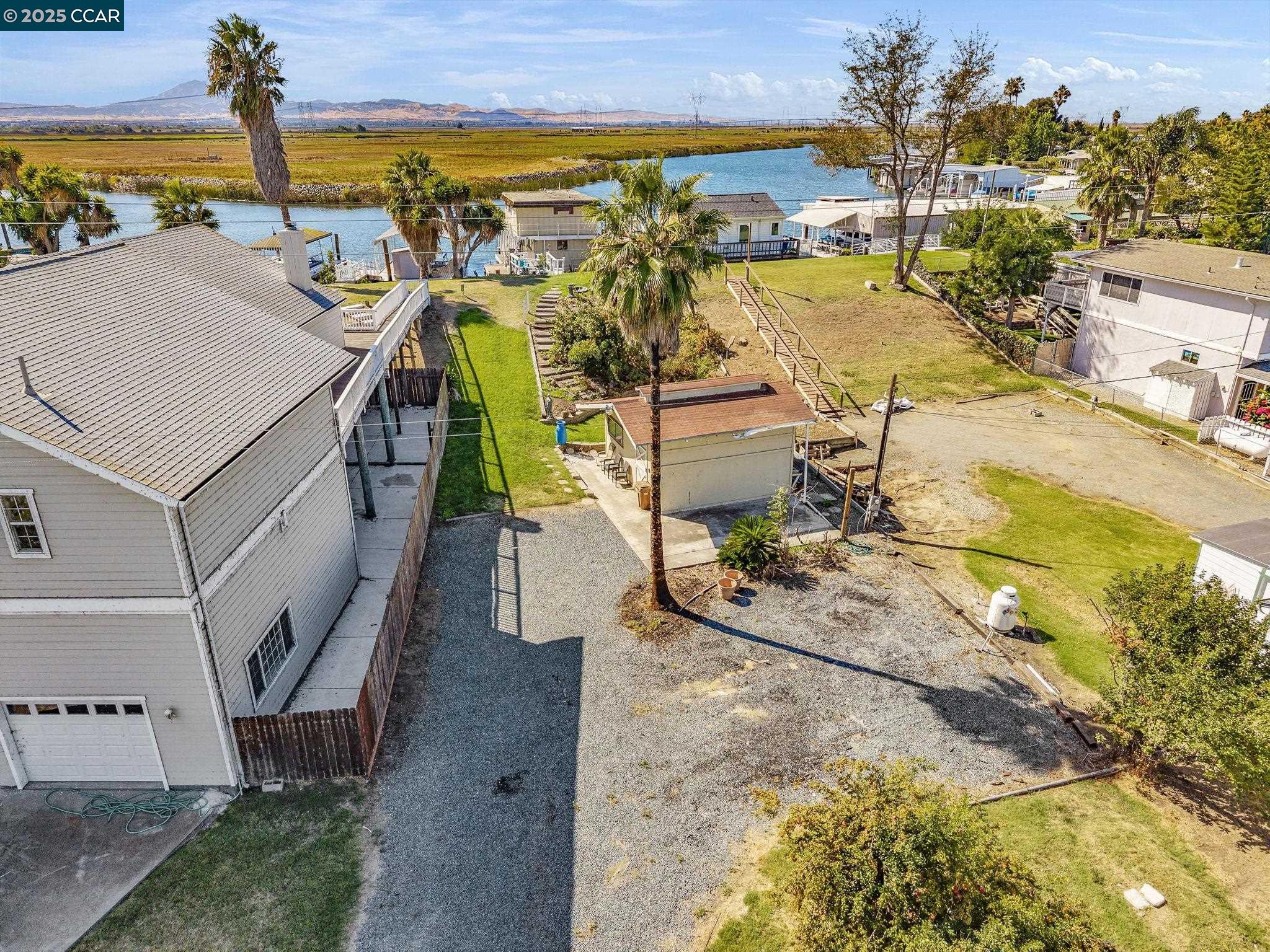 1818 Taylor Road Bethel Island, CA 94511 - Photo 3 of 59 an aerial view of residential houses with outdoor space