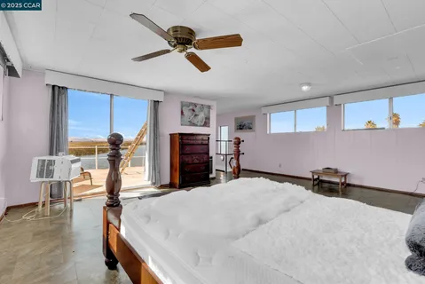 a view of a room with furniture and window