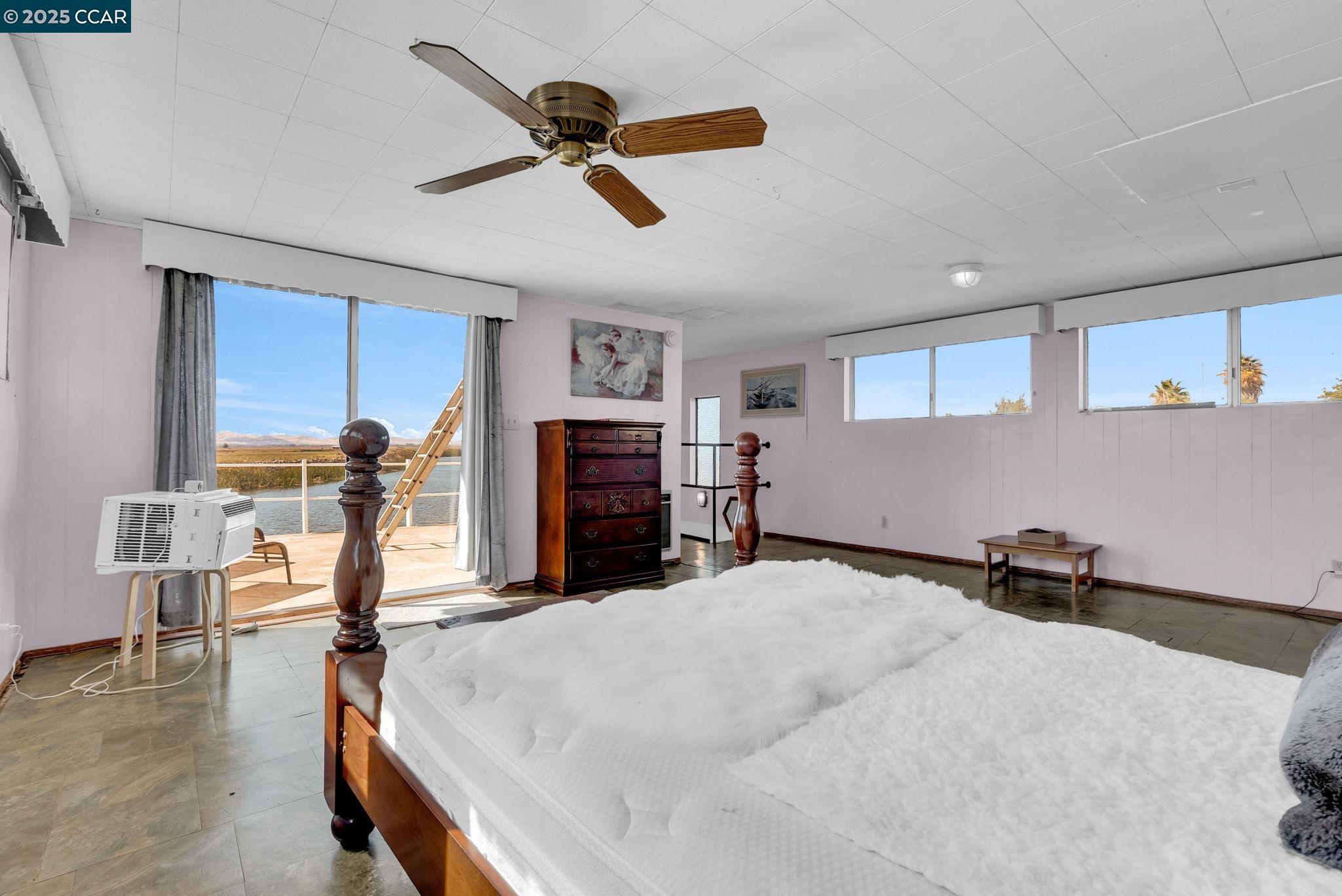 1818 Taylor Road Bethel Island, CA 94511 - Photo 34 of 59 a bed room with furniture and a window