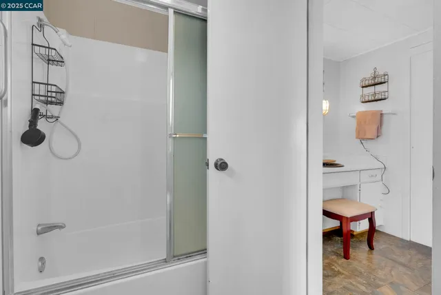 a view of a chair and tables in patio of the house
