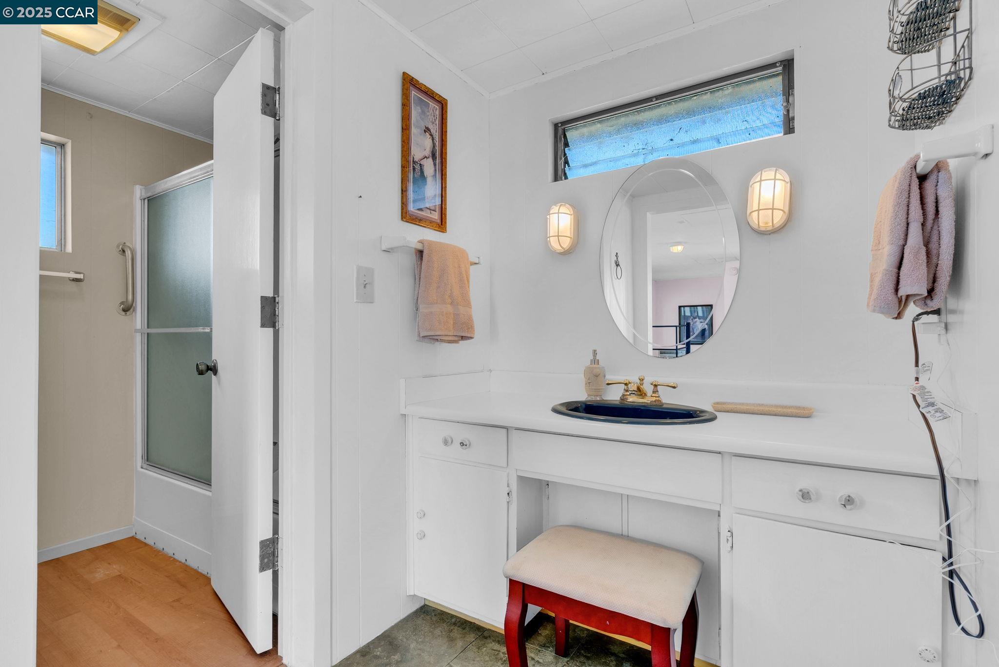 1818 Taylor Road Bethel Island, CA 94511 - Photo 37 of 59 a bathroom with a toilet a sink and mirror