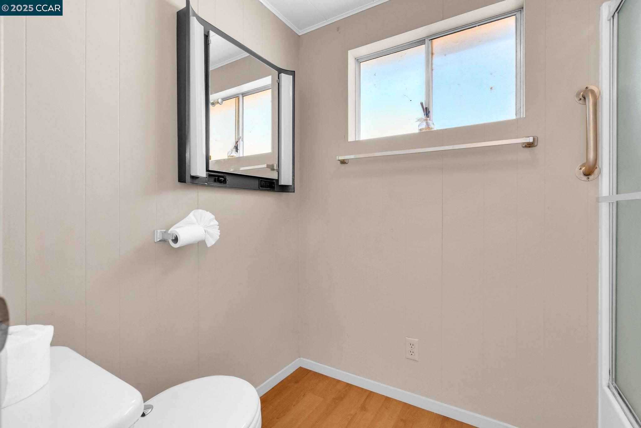 1818 Taylor Road Bethel Island, CA 94511 - Photo 38 of 59 a bathroom with a toilet sink and mirror