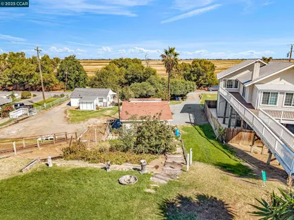 an aerial view of a house with a ocean view