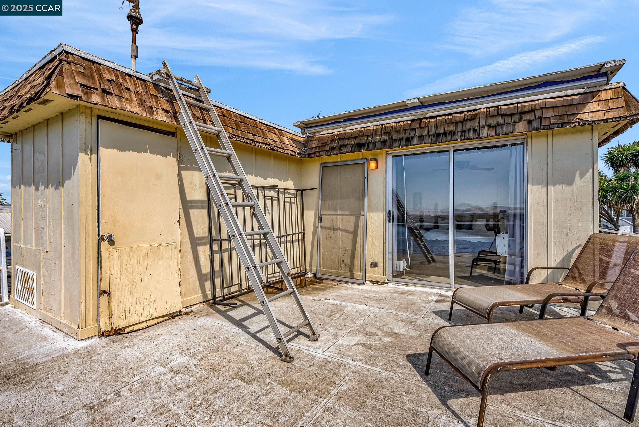 1818 Taylor Road Bethel Island, CA 94511 - Photo 41 of 59 a view of a chair and tables in patio of the house