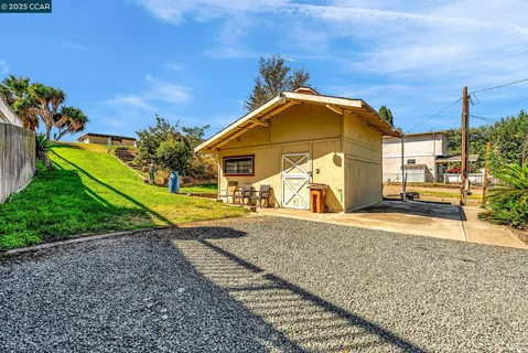 a view of a garden with a building in the background