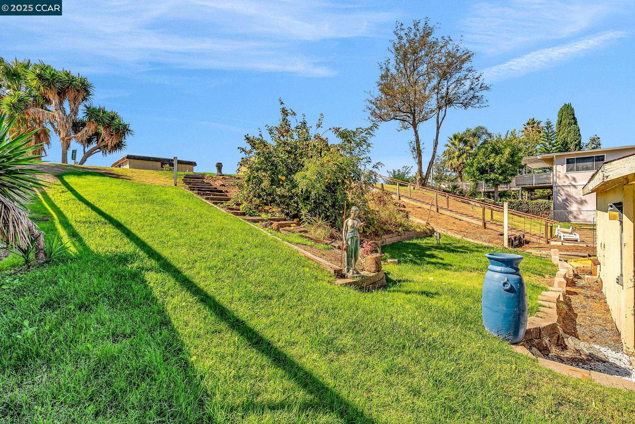 1818 Taylor Road Bethel Island, CA 94511 - Photo 53 of 59 a view of a garden with a building in the background