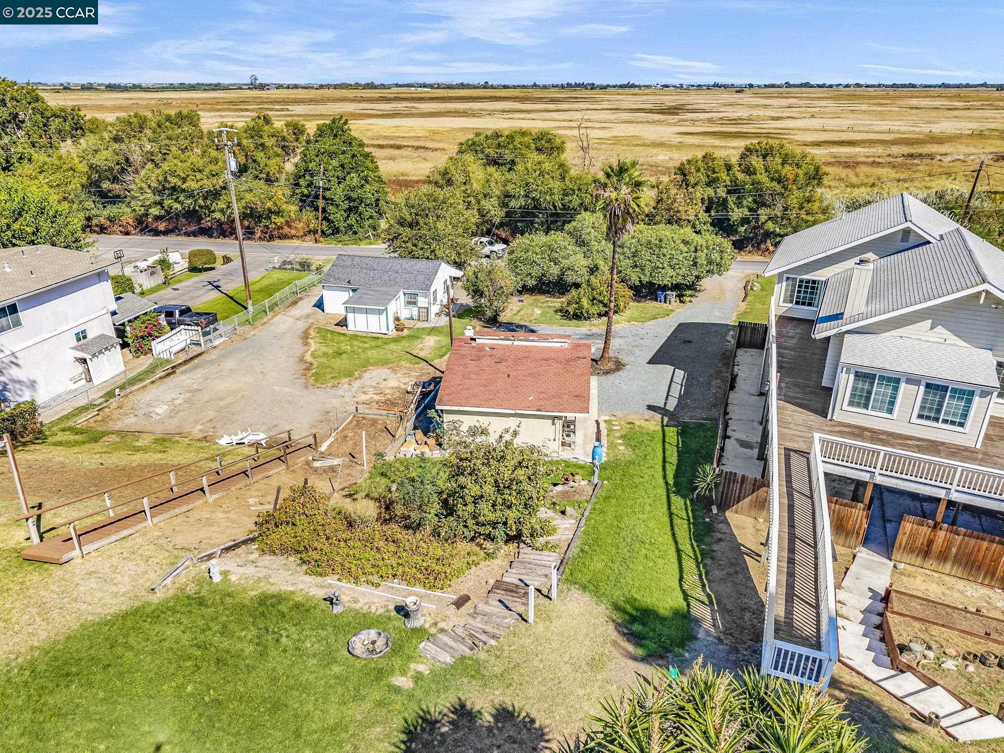 1818 Taylor Road Bethel Island, CA 94511 - Photo 58 of 59 an aerial view of residential houses with outdoor space and ocean view