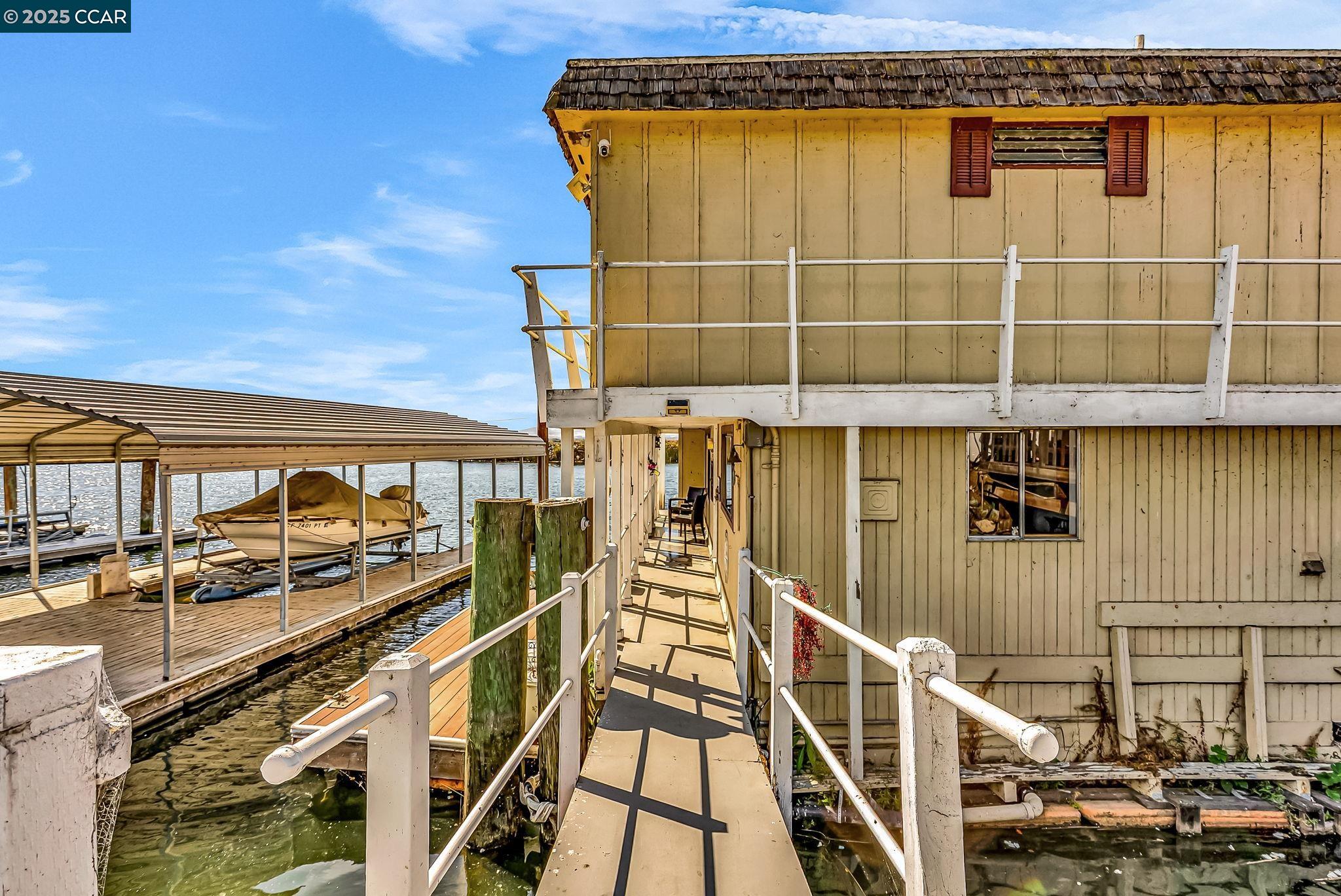 1818 Taylor Road Bethel Island, CA 94511 - Photo 10 of 59 a view of a balcony with furniture and wooden floor