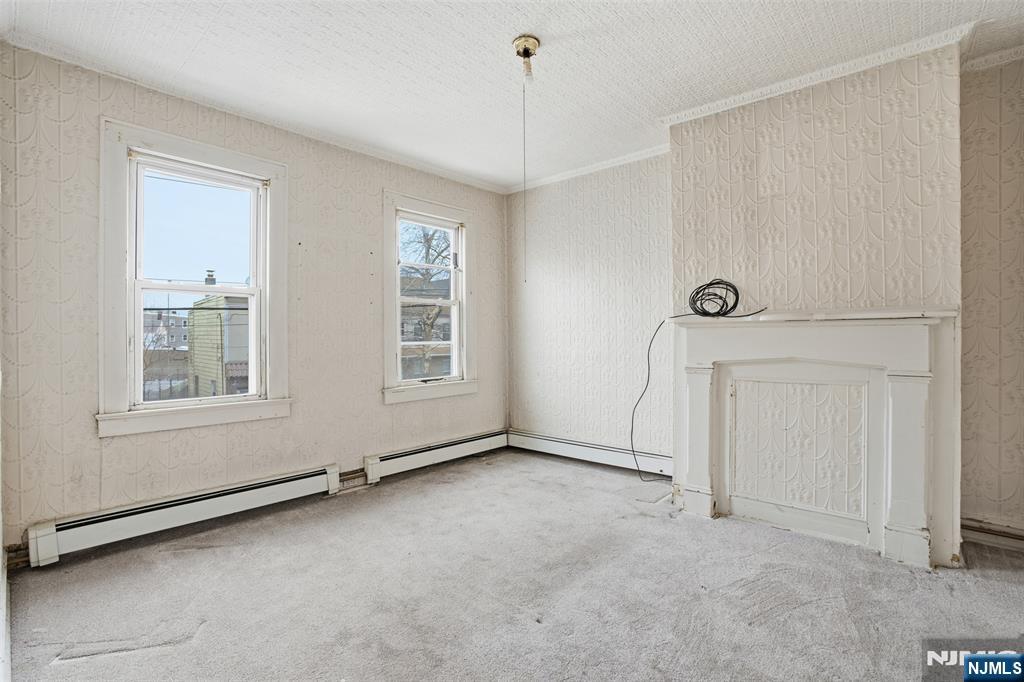 209 Hamilton Street Harrison, NJ 07029 - Photo 17 of 26 an empty room with windows