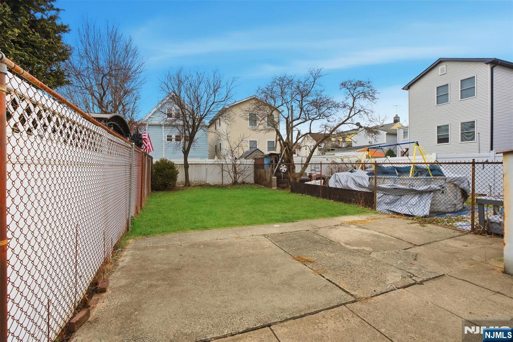 209 Hamilton Street Harrison, NJ 07029 - Photo 21 of 26 a view of a house with a yard