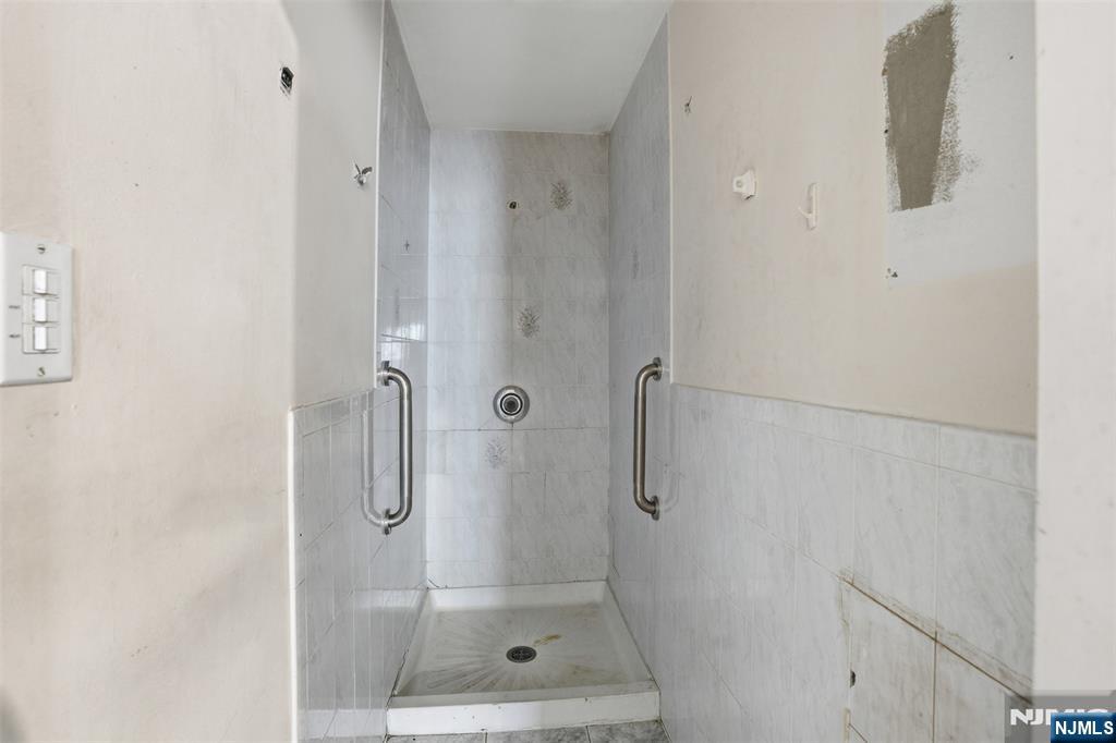 209 Hamilton Street Harrison, NJ 07029 - Photo 10 of 26 a bathroom with a shower