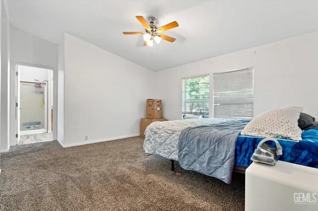 a bedroom with bed and window
