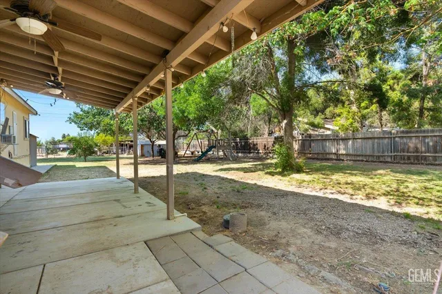 a view of yard with swimming pool