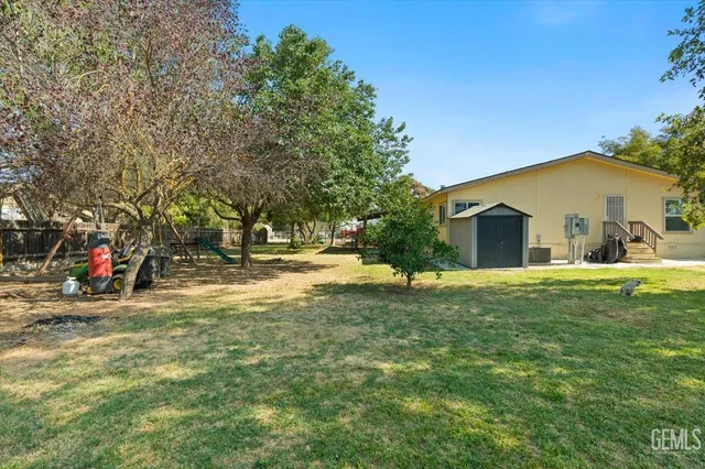 a view of a house with a yard and garage