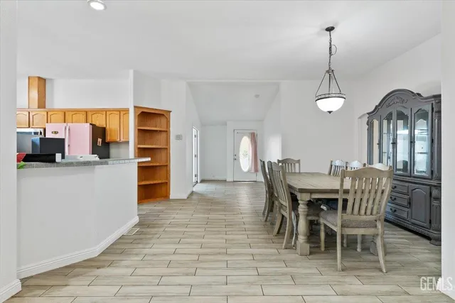 a view of a dining room with furniture and window