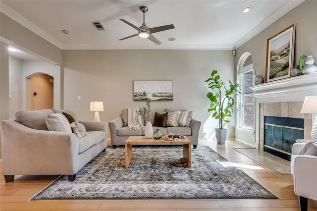 a living room with furniture and a fireplace