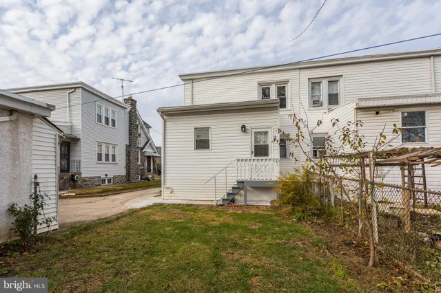 a view of a house with swimming pool and sitting area