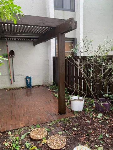 a view of a patio with table and chairs