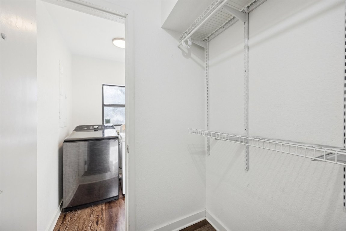 604 Pressler Street Austin, TX 78703 - Photo 12 of 40 Walk in closet featuring washer / dryer and dark wood-style flooring