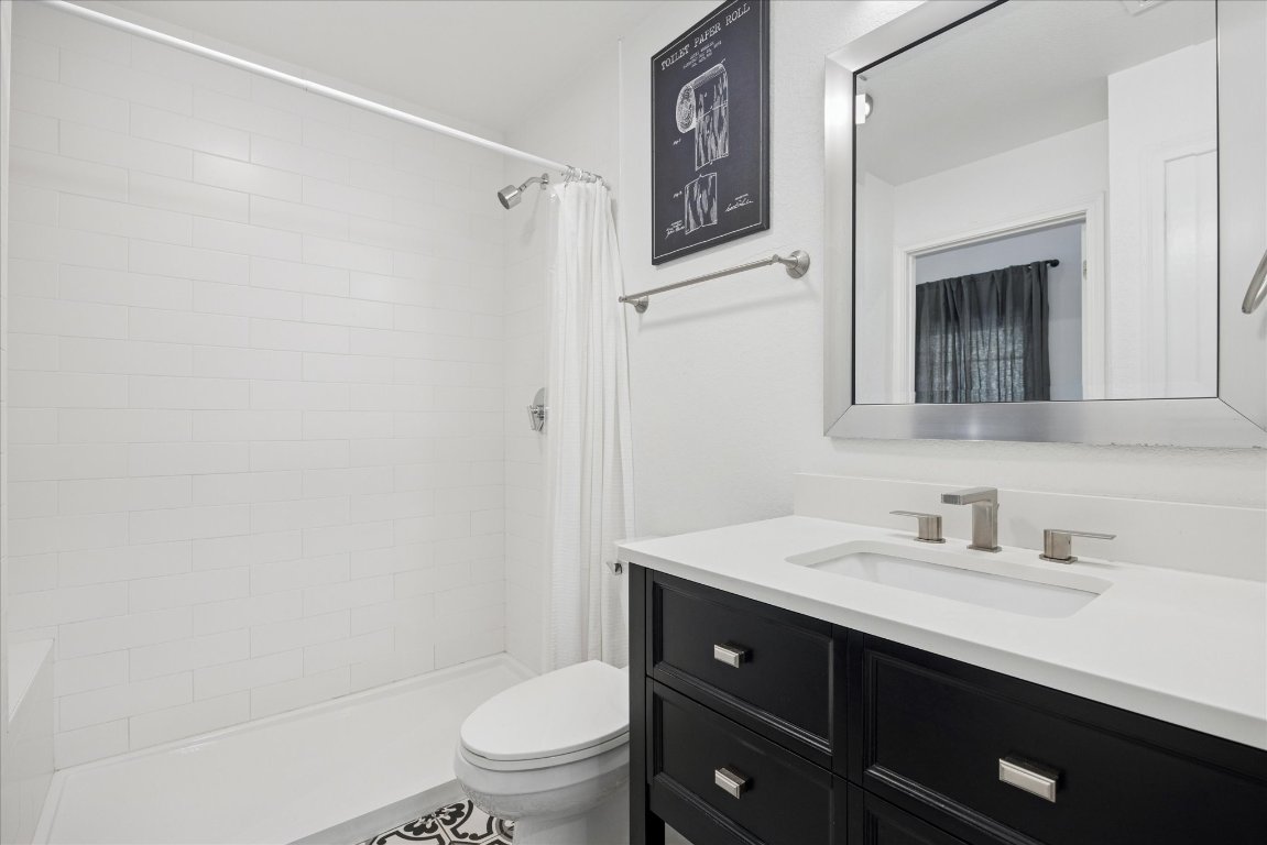 604 Pressler Street Austin, TX 78703 - Photo 19 of 40 Full bathroom with vanity and a shower stall