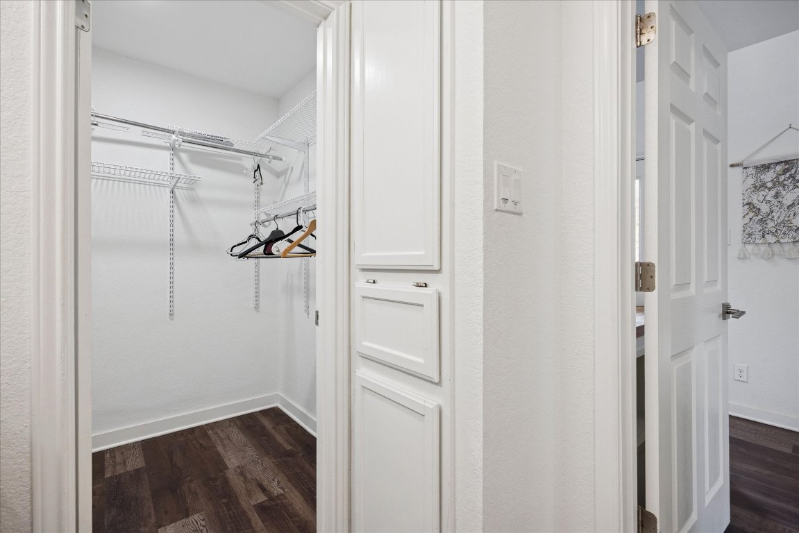 604 Pressler Street Austin, TX 78703 - Photo 20 of 40 Spacious closet featuring dark wood-type flooring