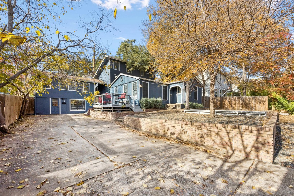 604 Pressler Street Austin, TX 78703 - Photo 2 of 40 View of front of home with a wooden deck and concrete driveway