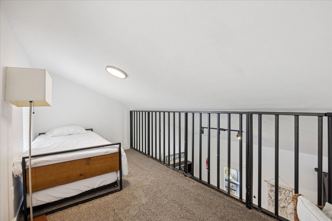 604 Pressler Street Austin, TX 78703 - Photo 21 of 40 Carpeted bedroom featuring vaulted ceiling