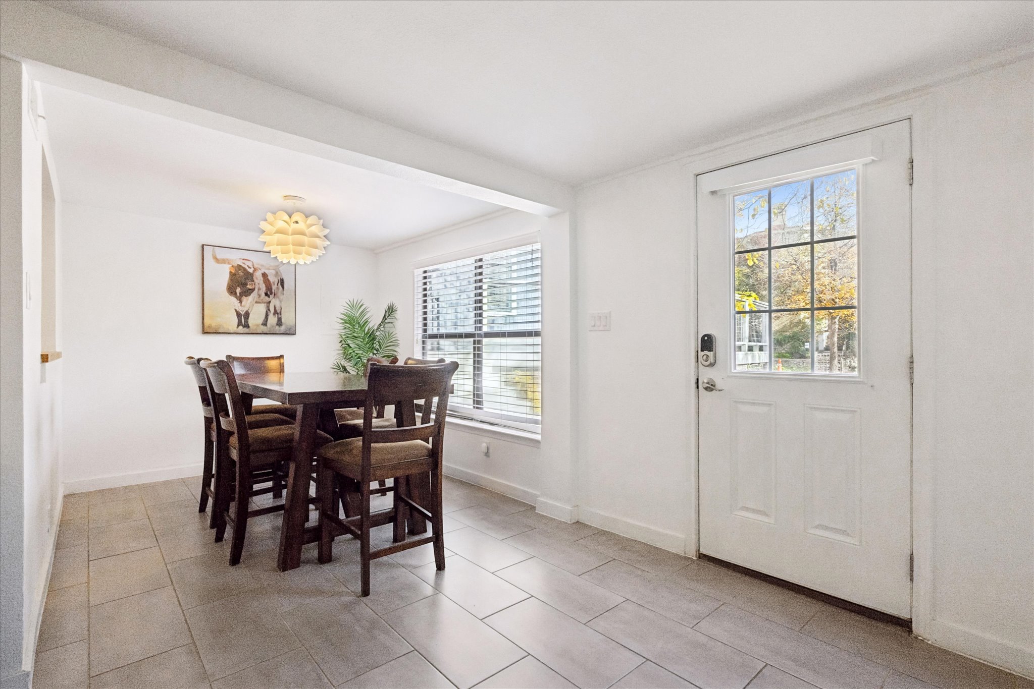 604 Pressler Street Austin, TX 78703 - Photo 26 of 40 a view of a dining room with furniture and a window