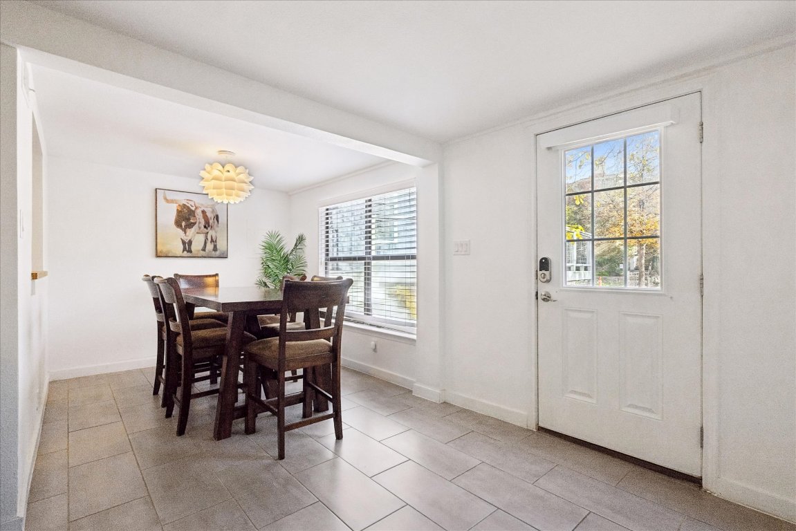 604 Pressler Street Austin, TX 78703 - Photo 26 of 40 Dining area with light tile patterned floors