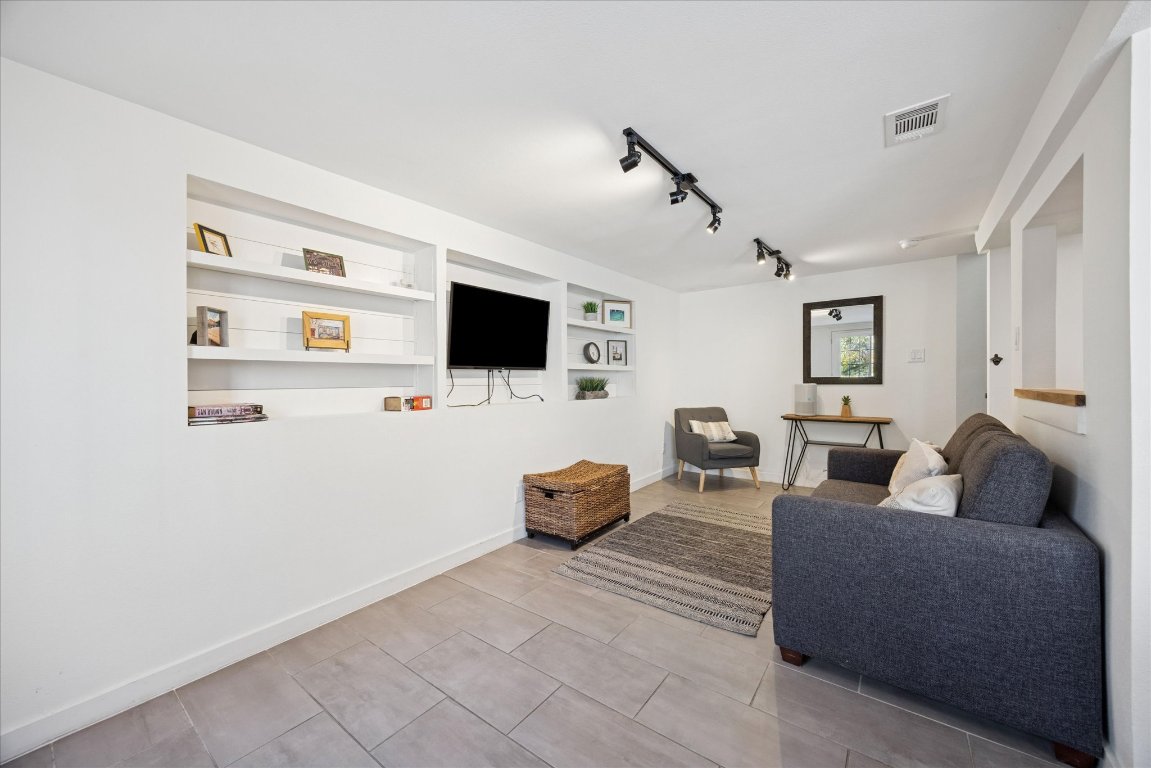 604 Pressler Street Austin, TX 78703 - Photo 30 of 40 Living room with track lighting and tile patterned flooring