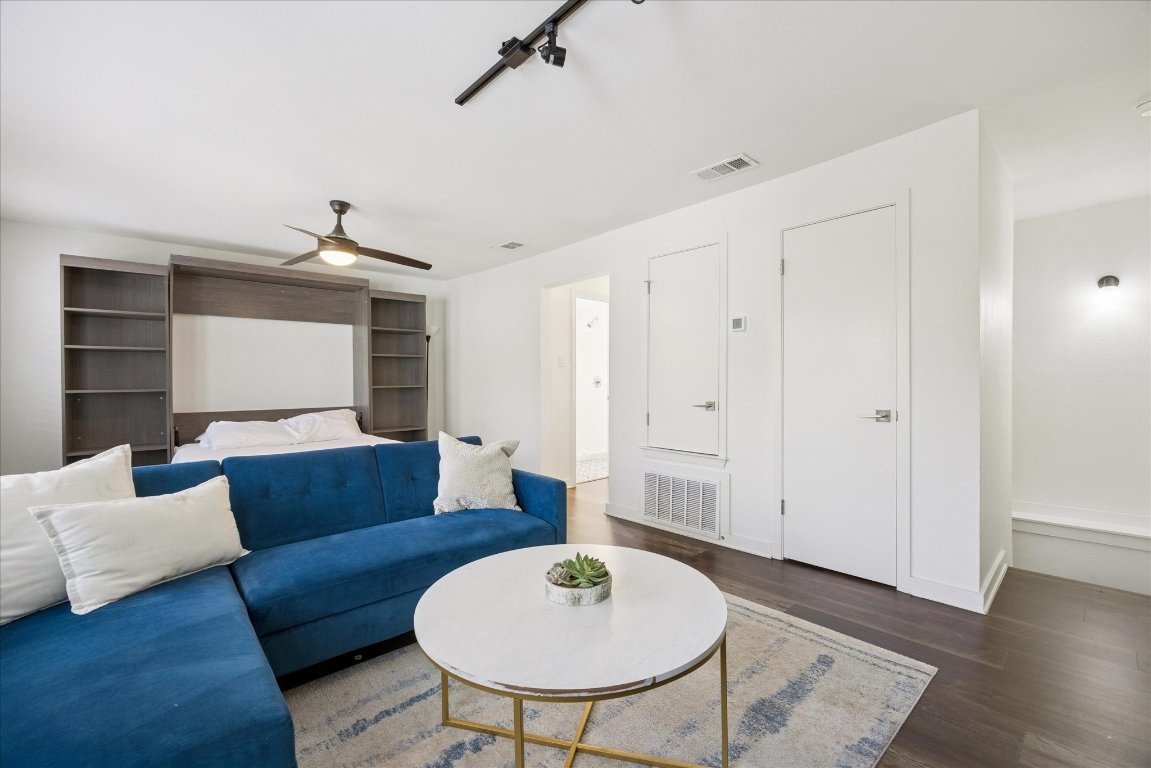604 Pressler Street Austin, TX 78703 - Photo 33 of 40 Living area with wood finished floors, rail lighting, and ceiling fan