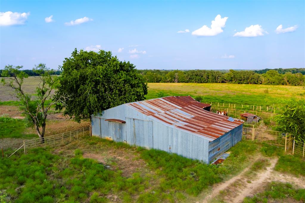 1515 County Road 510 Hamilton, TX 76531 - Photo 5 of 12 a view of a house with pool and a yard