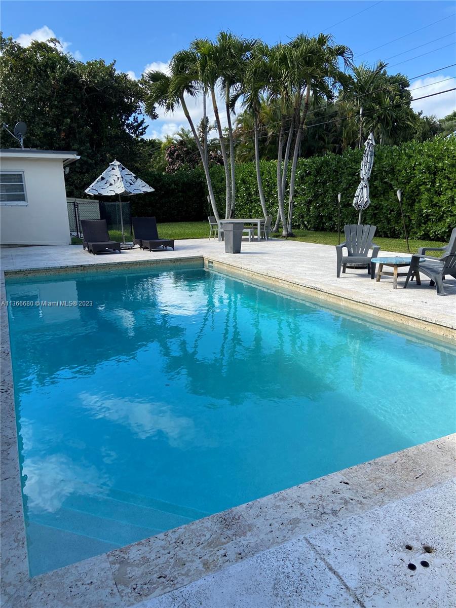Pinecrest Pinecrest, FL 33156 - Photo 11 of 25 a view of a swimming pool with a yard