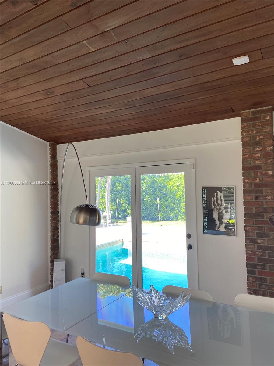 Pinecrest Pinecrest, FL 33156 - Photo 13 of 25 a outdoor space with the couches and dining table chair