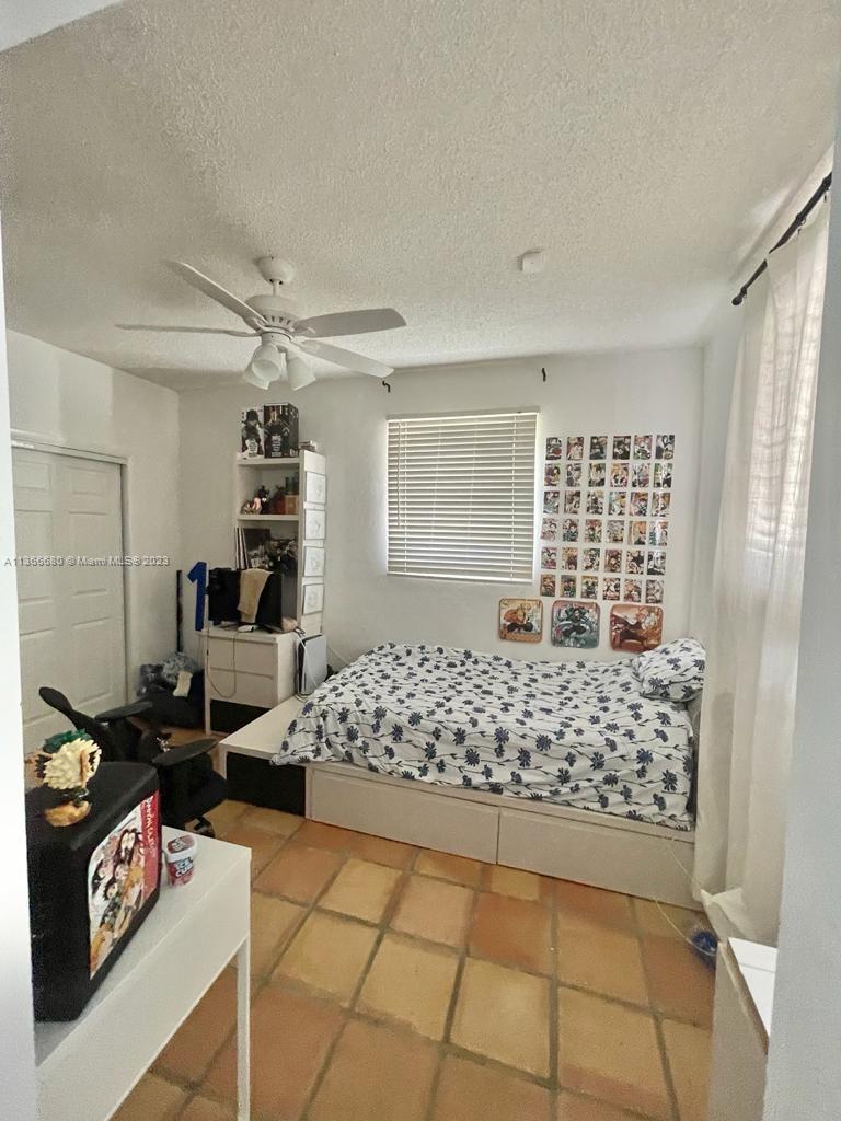 Pinecrest Pinecrest, FL 33156 - Photo 20 of 25 a bedroom with a bed and a window