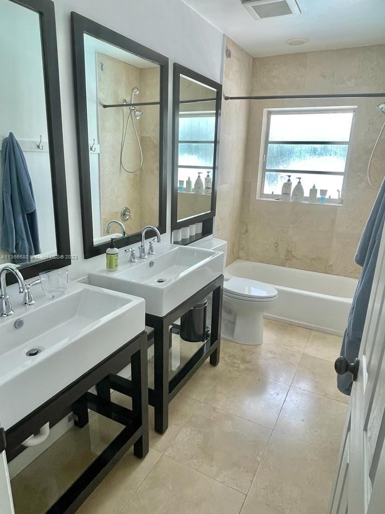 Pinecrest Pinecrest, FL 33156 - Photo 24 of 25 a bathroom with a sink and a mirror