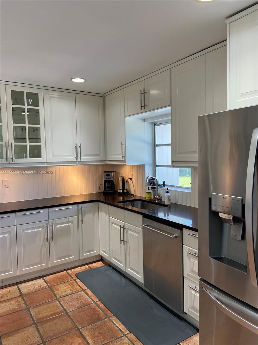 Pinecrest Pinecrest, FL 33156 - Photo 9 of 25 a kitchen with stainless steel appliances granite countertop a sink stove and refrigerator