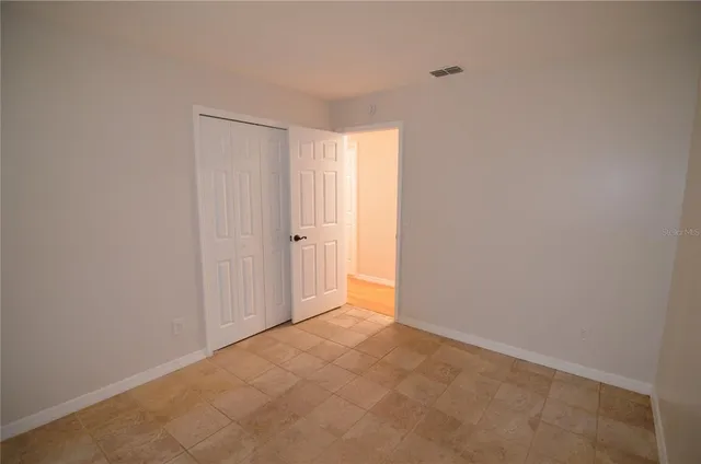 a view of a hallway with a wooden door