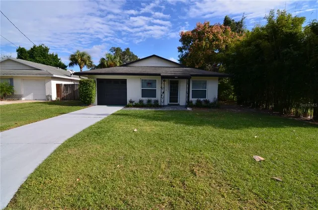 front view of a house with a yard