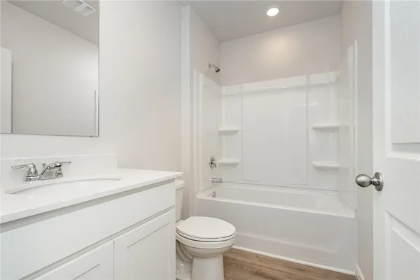 a bathroom with a sink a toilet and a bathtub