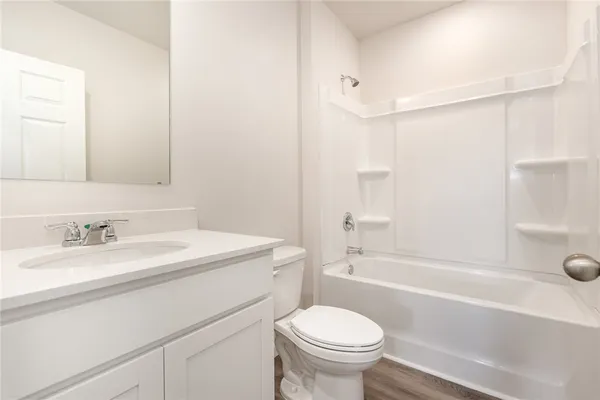 a bathroom with a sink a toilet and a bathtub