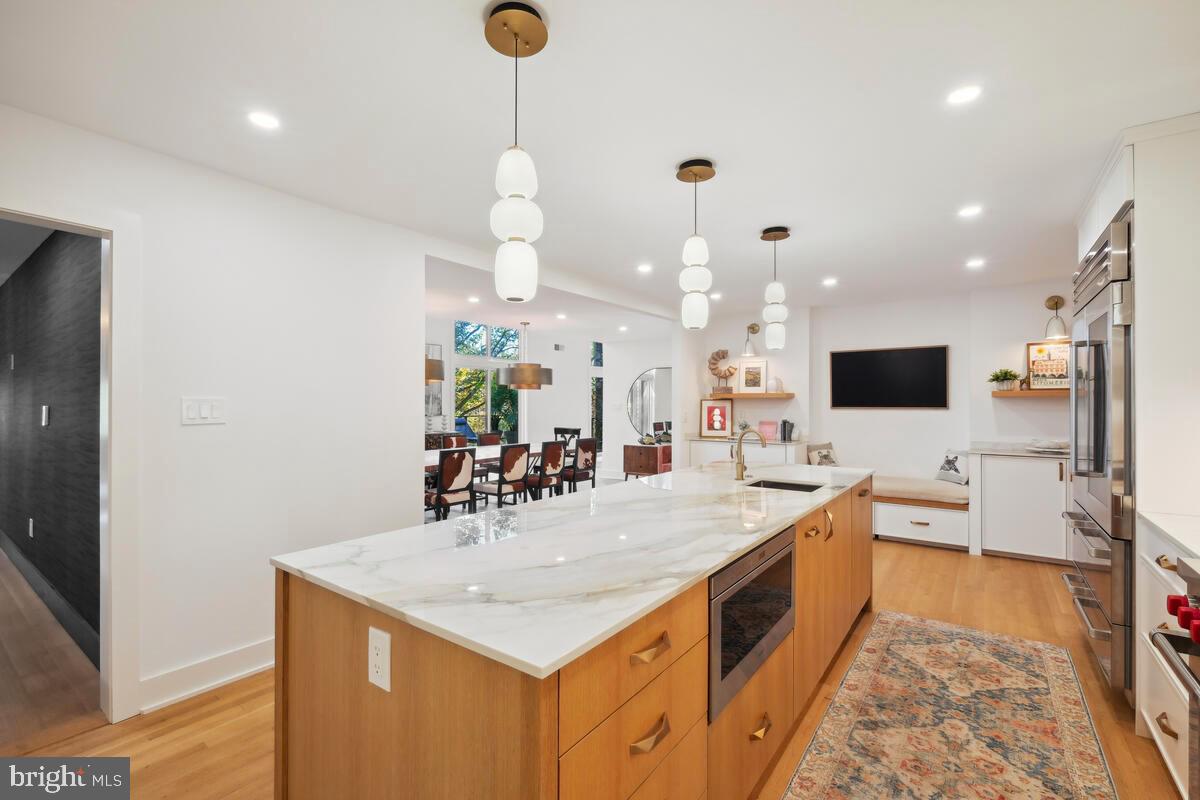 11900 Viewcrest Terrace Silver Spring, MD 20902 - Photo 12 of 69 a large white kitchen with a large island