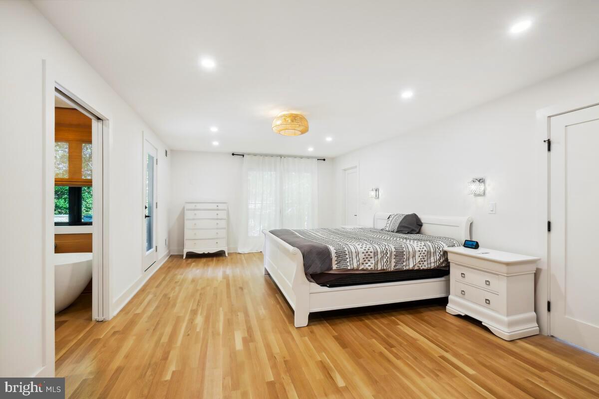 11900 Viewcrest Terrace Silver Spring, MD 20902 - Photo 28 of 69 a spacious bedroom with a bed and a window