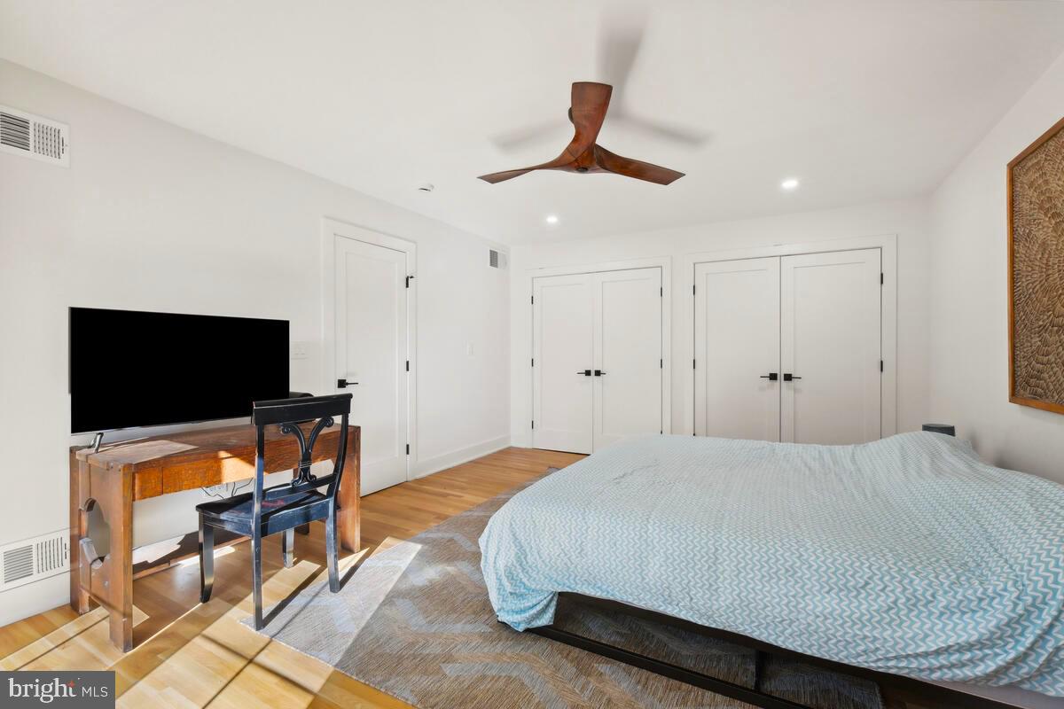 11900 Viewcrest Terrace Silver Spring, MD 20902 - Photo 35 of 69 a bedroom with a bed and a flat screen tv