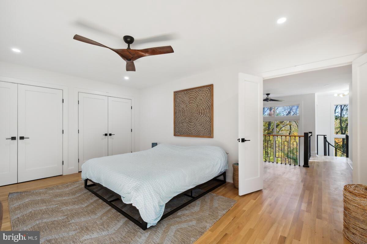 11900 Viewcrest Terrace Silver Spring, MD 20902 - Photo 37 of 69 a spacious bedroom with a bed and a walk in closet