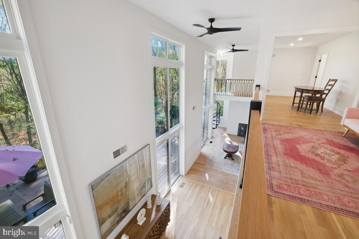 11900 Viewcrest Terrace Silver Spring, MD 20902 - Photo 43 of 69 a living room with furniture and a dining table with wooden floor