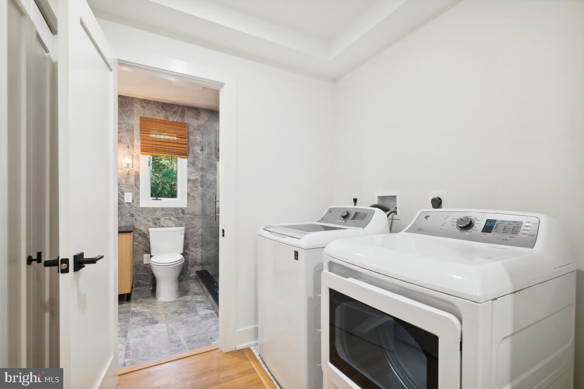 11900 Viewcrest Terrace Silver Spring, MD 20902 - Photo 48 of 69 a utility room with dryer and washer